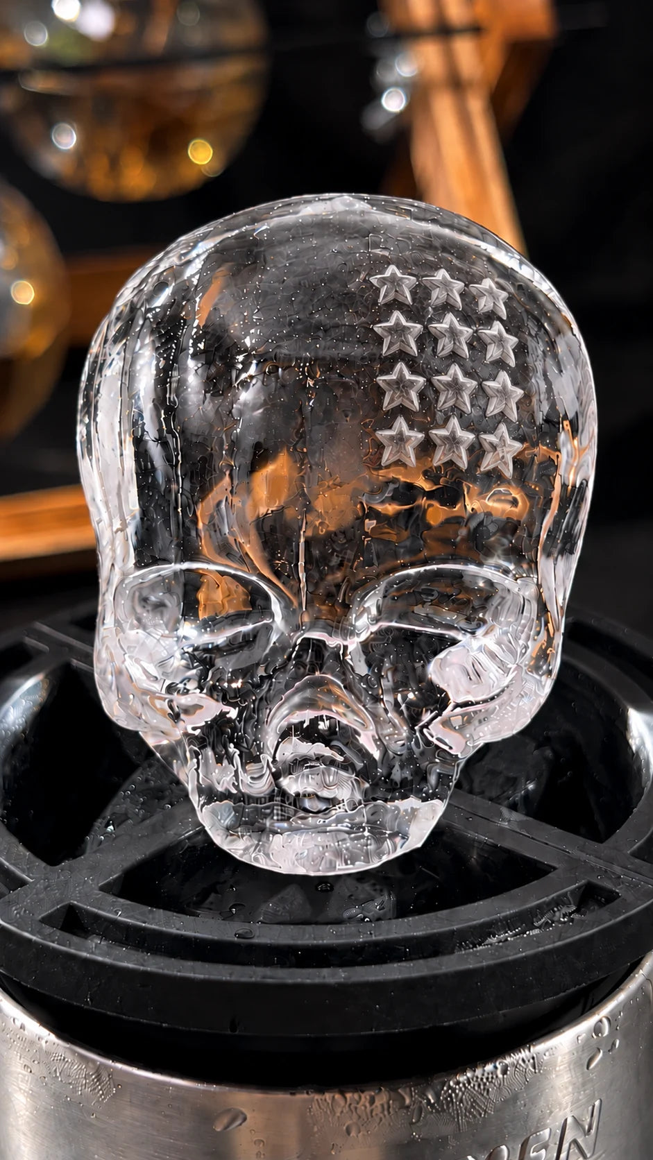 Close-up of a clear skull-shaped ice piece with star details