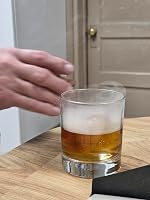 Customer example photo of a smoked drink in a glass on a wooden table