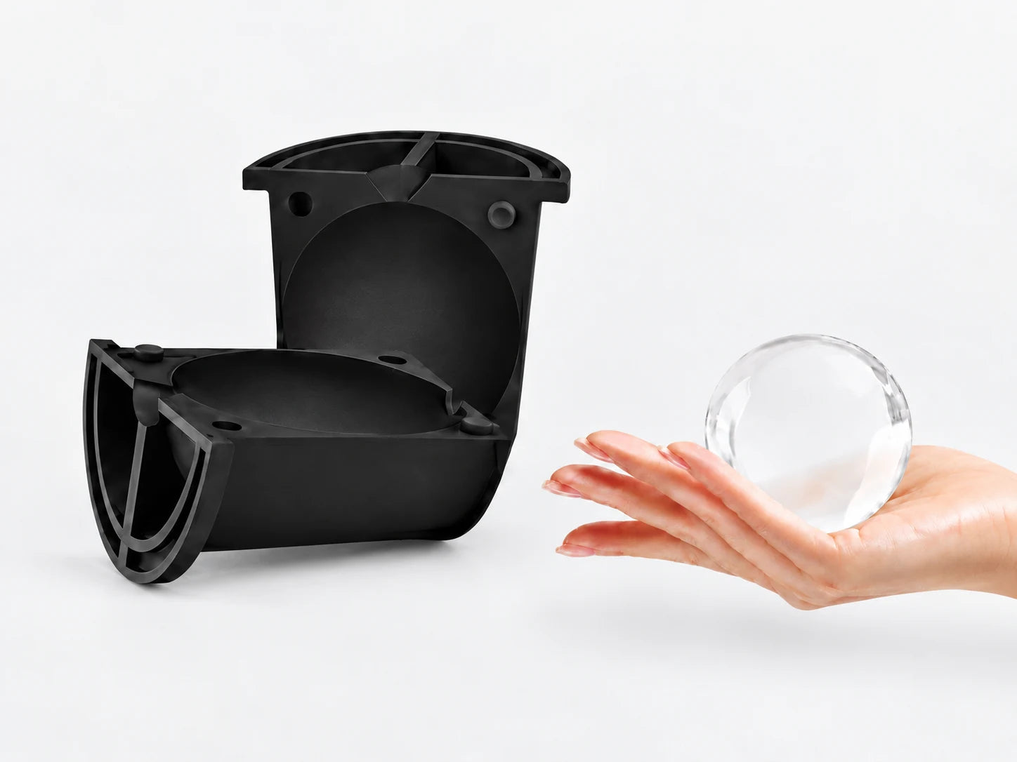 Releasing a clear ice sphere from the mold